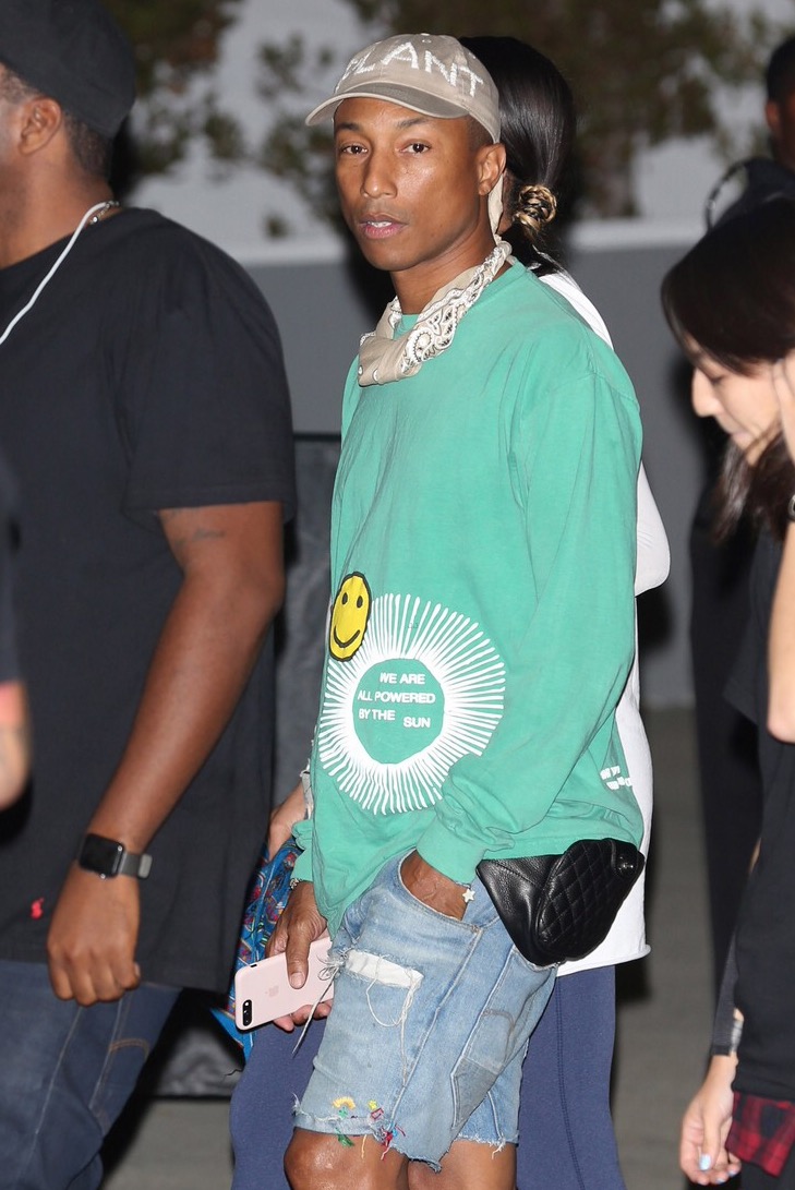 Spotted: Pharrell Williams seen wearing pink Timberland boots and Chanel fannypack