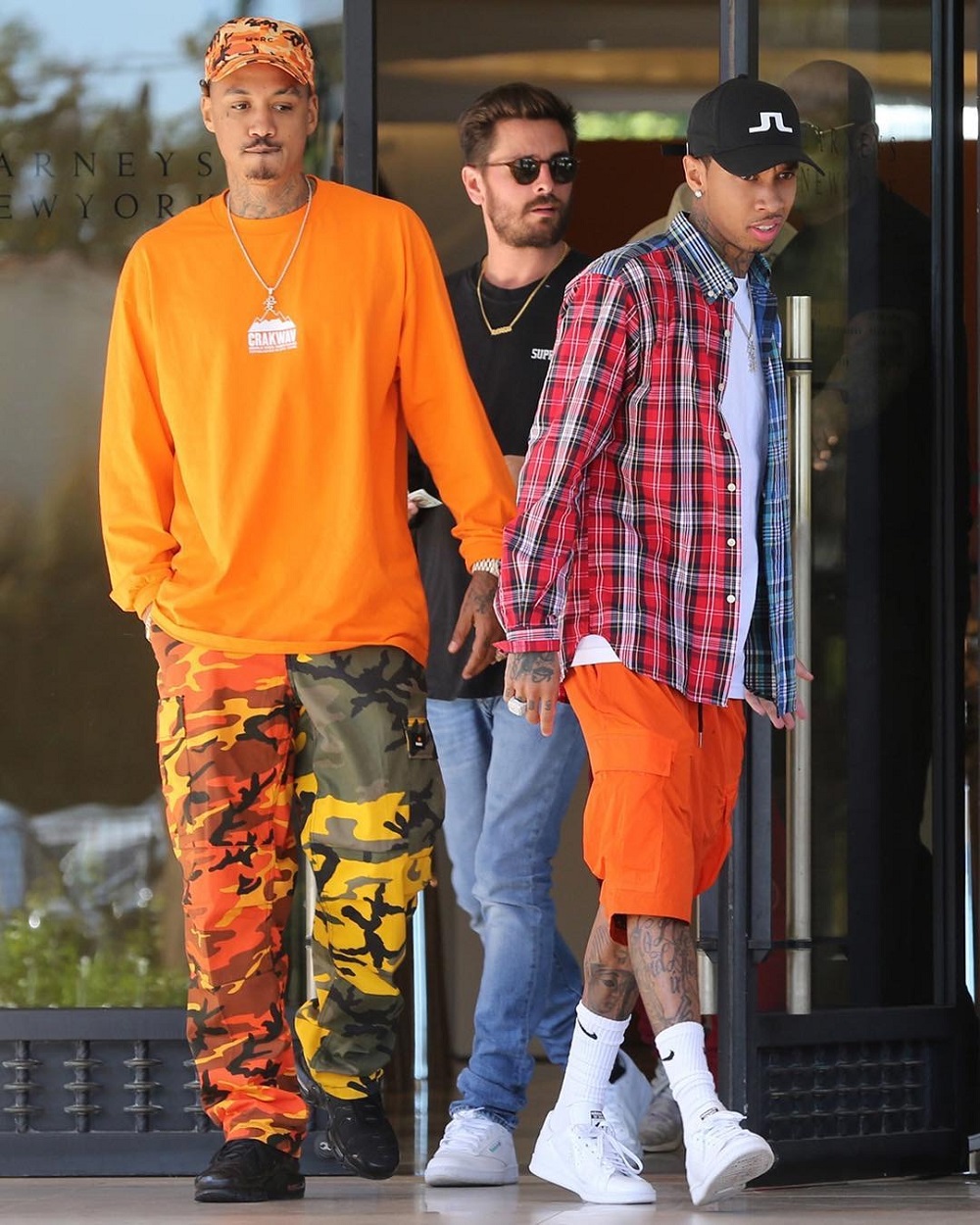 SPOTTED: Tyga in Palace Shirt, J Lindeberg Hat and Raf Simons x Adidas Sneakers