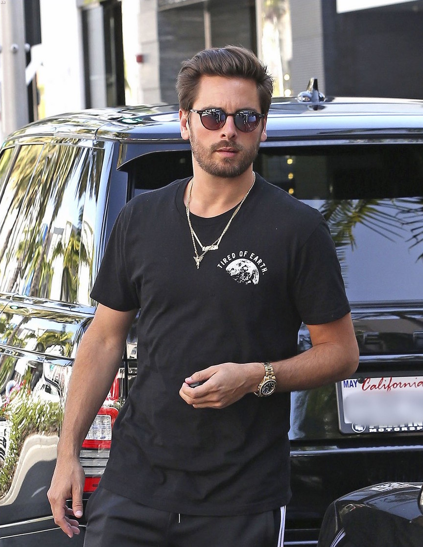 SPOTTED: Scott Disick in ”Tired of Earth” T-Shirt, Adidas Pants and Yeezy Calabasas Sneakers