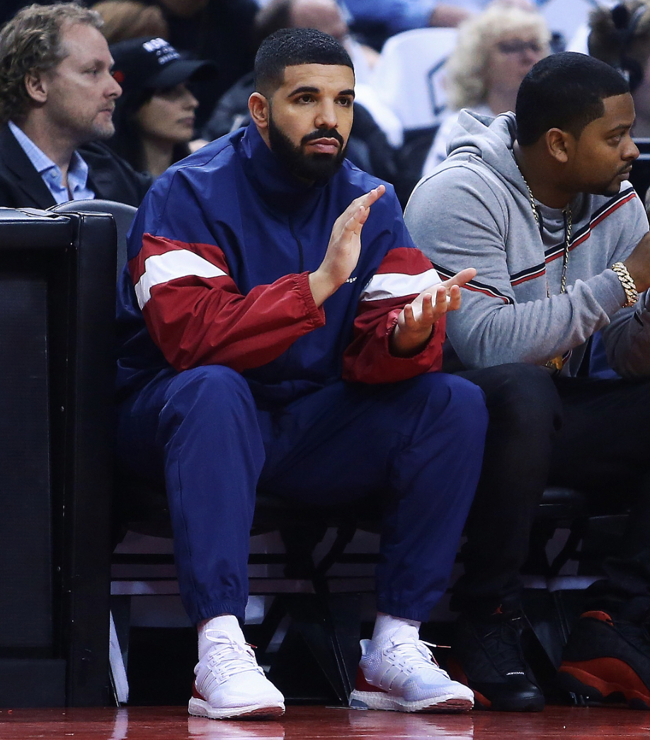 SPOTTED: Drake Sits Courtside in Balenciaga Tracksuit & adidas Trainers