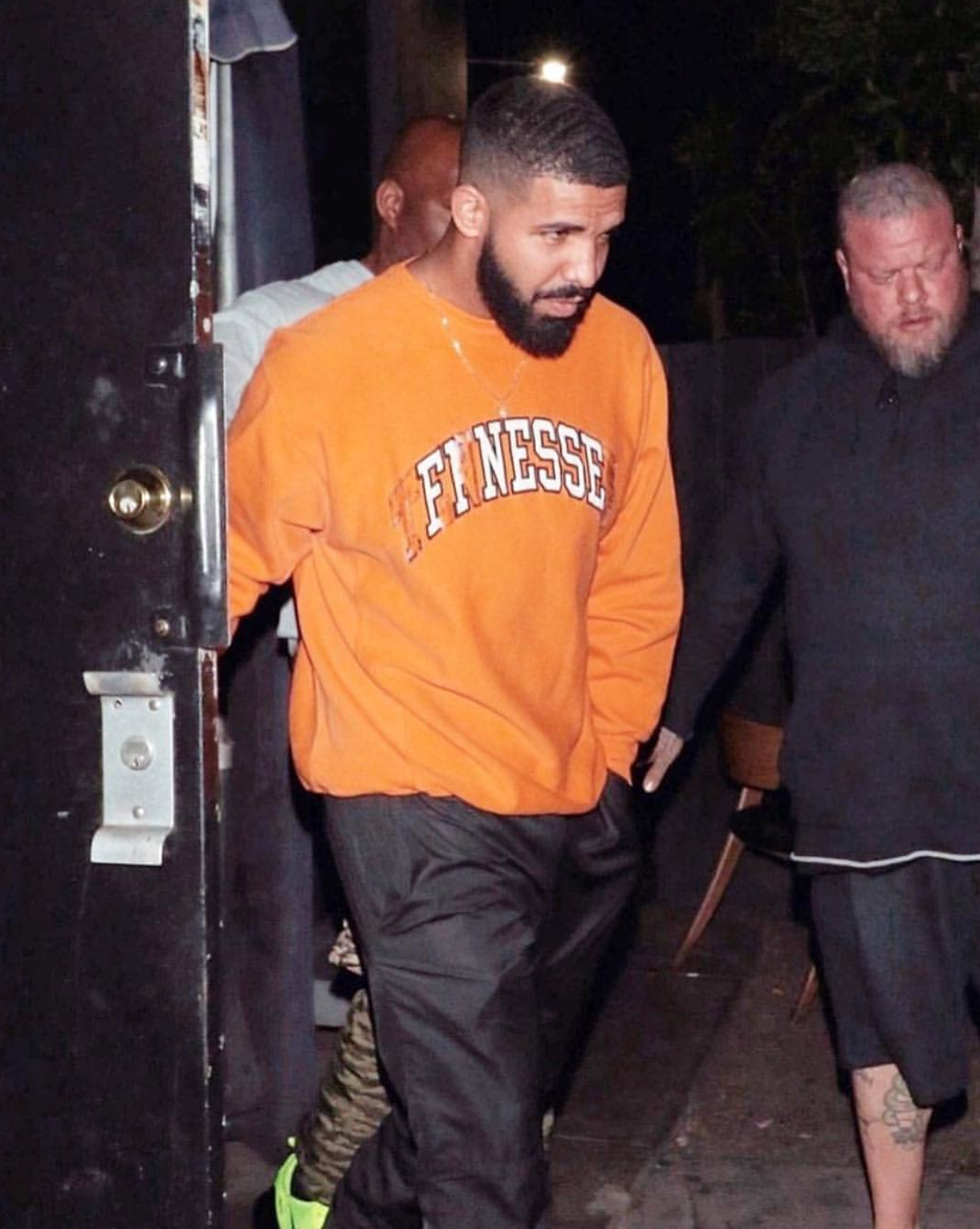 Drake in Orange Sweatshirt