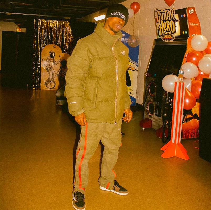 SPOTTED: Travis Scott Rocks The North Face and a New Reversed-Swoosh Air Jordan 1 Collab