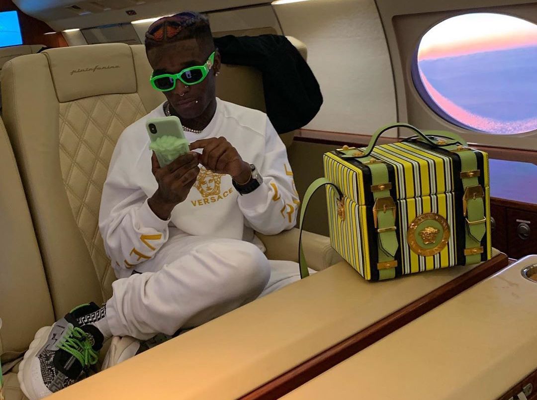 SPOTTED: Lil Uzi Vert Dripping in Versace On Private Jet