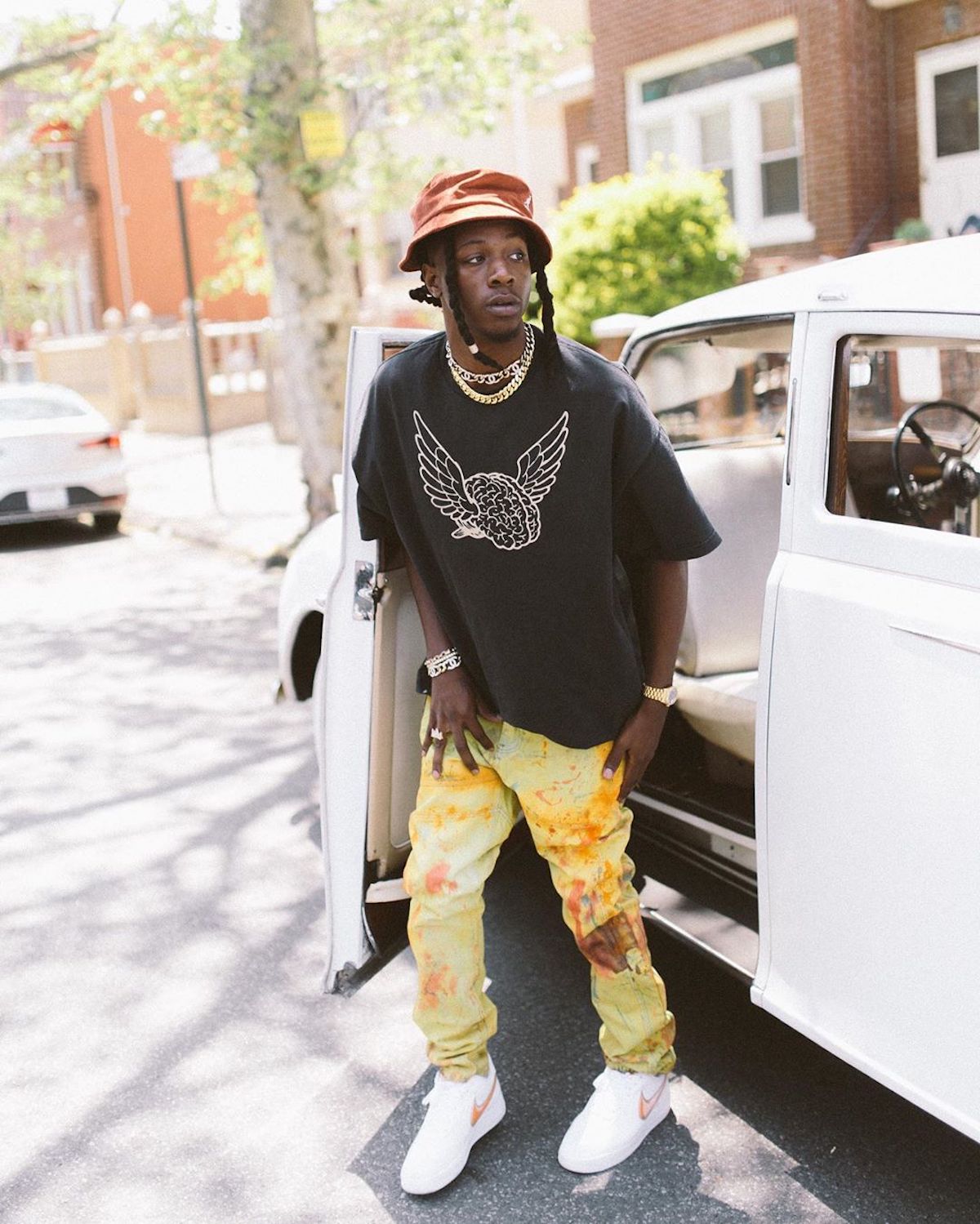 SPOTTED: Joey Badass Dons Bold Yellow Trousers & Bucket Hat in NYC