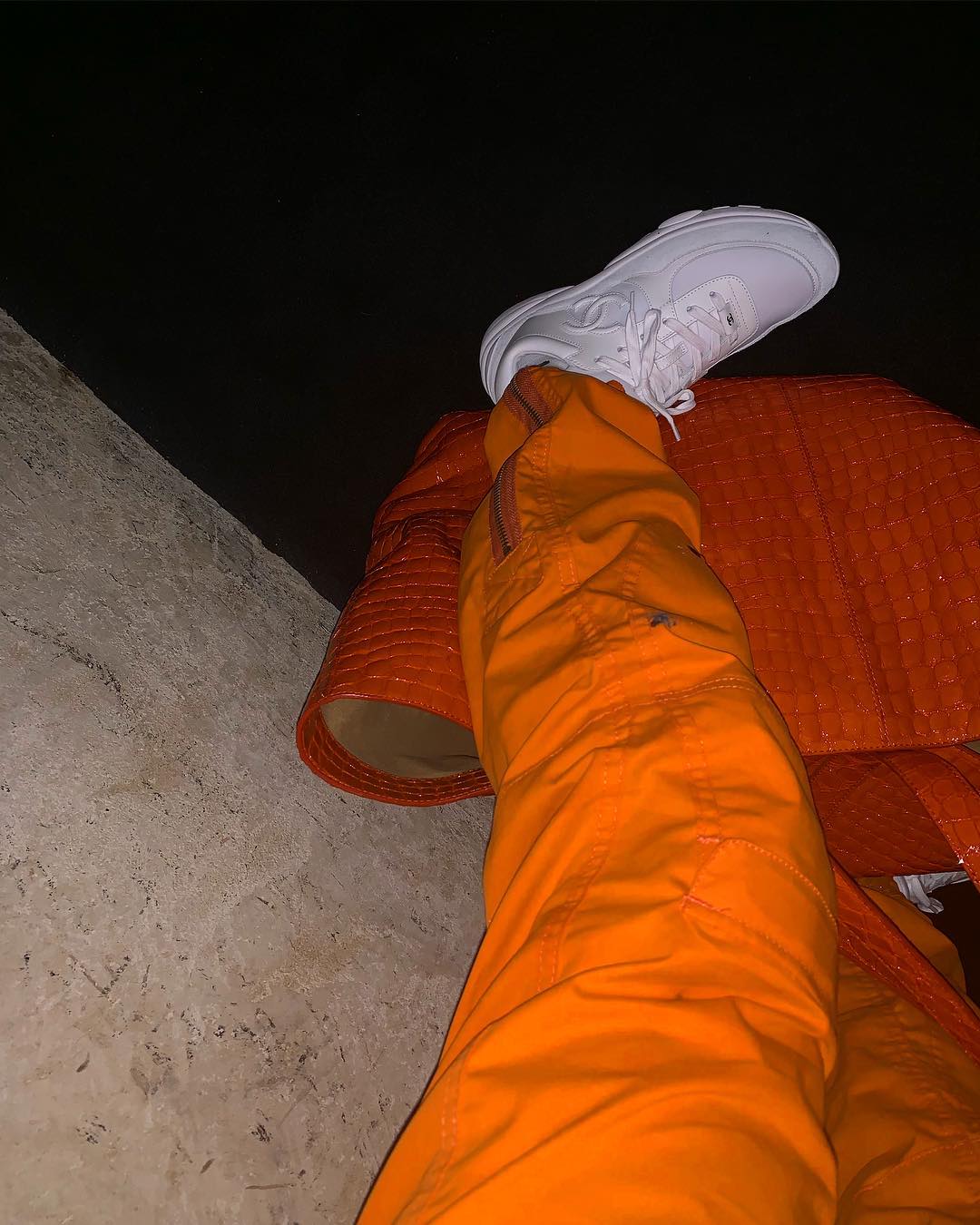 Louis Vuitton Orange Monogram sweater worn by Lil Uzi Verts on his