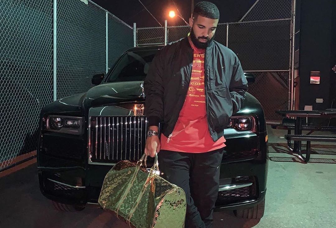 SPOTTED: Drake Stunts In Louis Vuitton Bag & Raf Simons T-Shirt