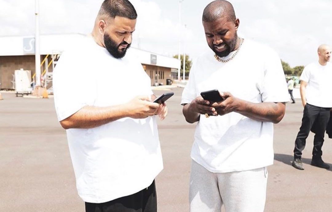 SPOTTED: Kanye West Gifts DJ Khaled YZY BSKT Sneakers On The Tarmac