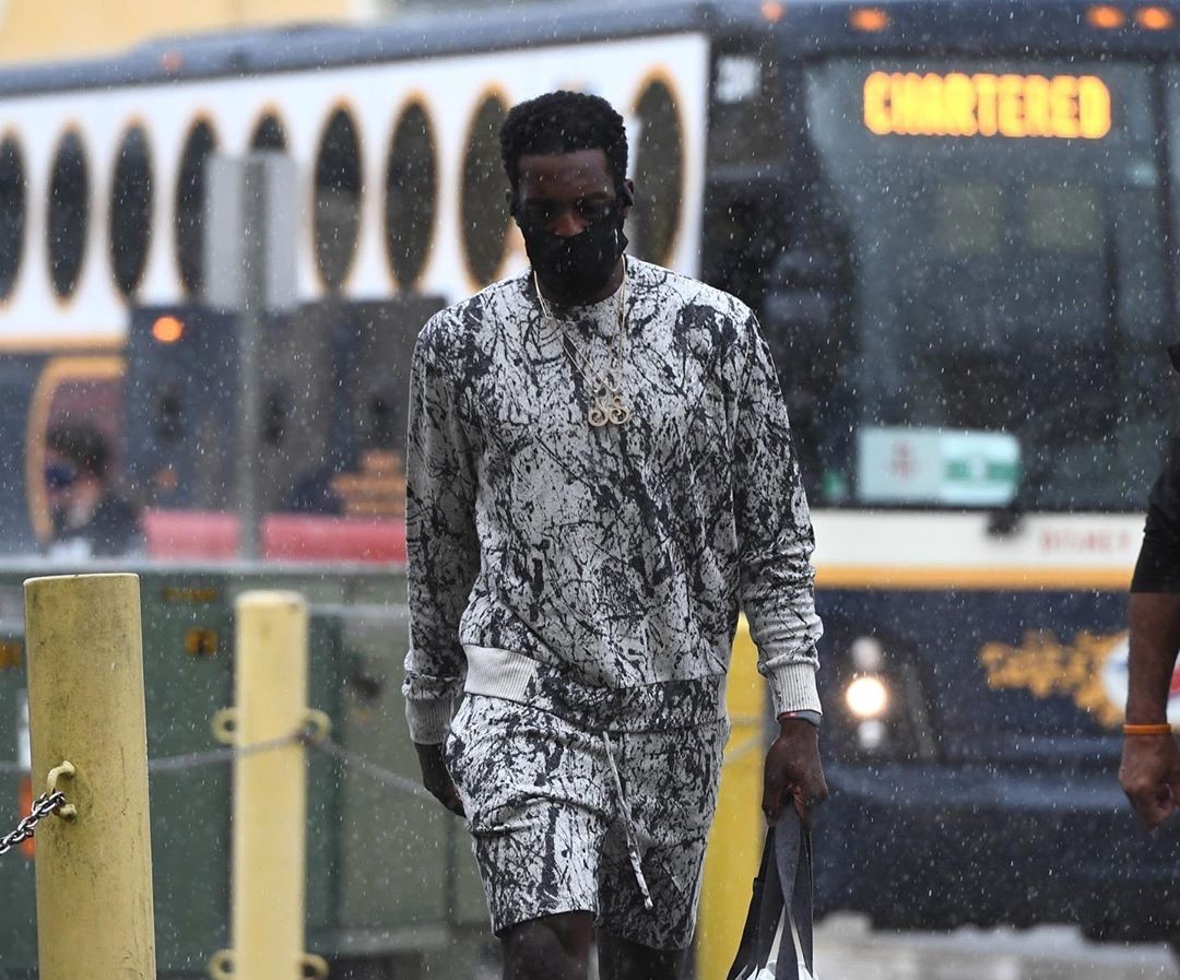 Spotted: Jeff Green Strides Through the Rain in Summertime Outfit