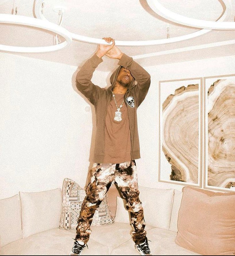 SPOTTED: Travis Scott Plays with Brown Hues