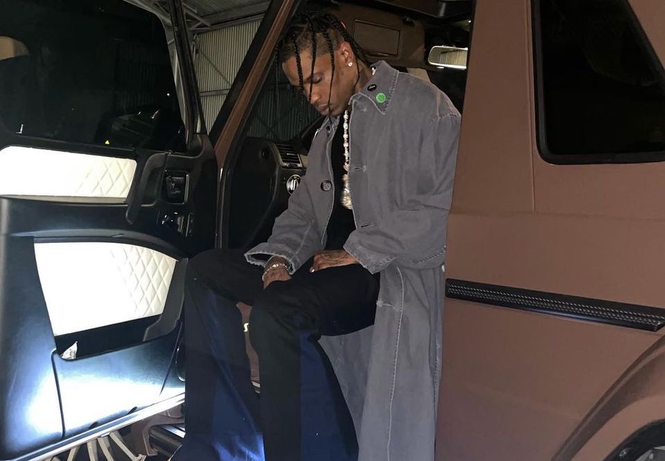 SPOTTED: Travis Scott rolls up in Raf Simons