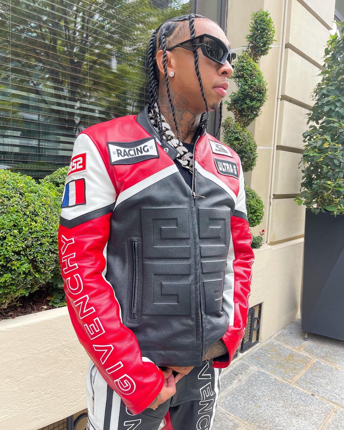 Tyga Wearing a LV Jacket With a Gucci x TNF Bucket Hat With a