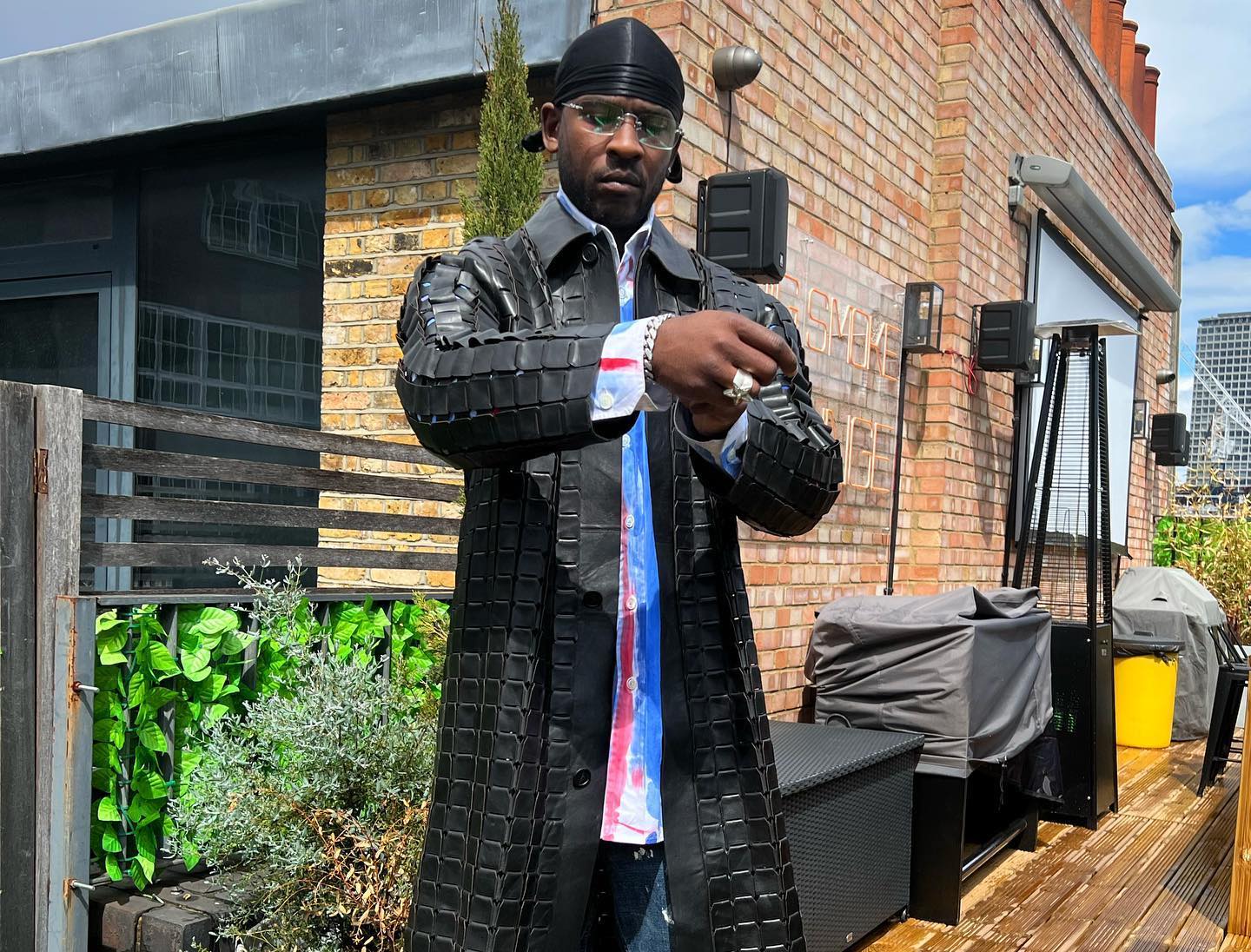 SPOTTED: Skepta dons Leather Coat & Prada Trainers