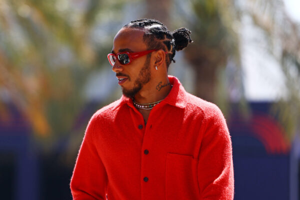 BAHRAIN, BAHRAIN - MARCH 02: Lewis Hamilton of Great Britain and Mercedes walks in the Paddock during previews ahead of the F1 Grand Prix of Bahrain at Bahrain International Circuit on March 02, 2023 in Bahrain, Bahrain. (Photo by Mark Thompson/Getty Images)