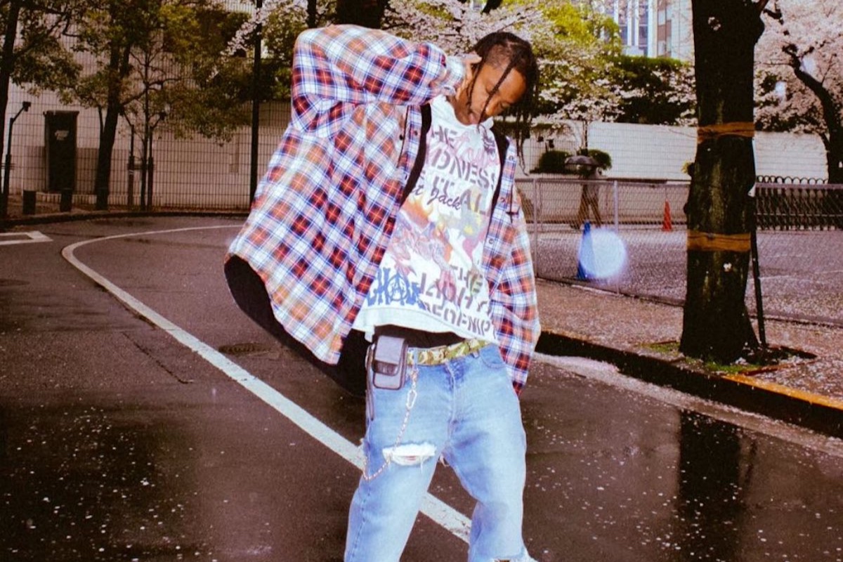 SPOTTED: Travis Scott is his Own Biggest Fan Wearing TS x Nike Air Jordan 4s, Balenciaga & more