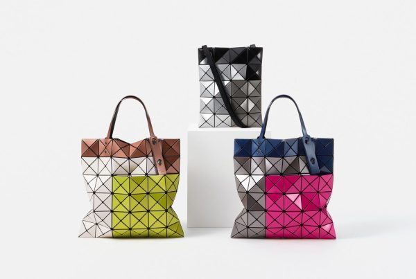 Images of three Bao Bao Issey Miyake bags from the "Tres" line. They all feature colour-blocked designs.