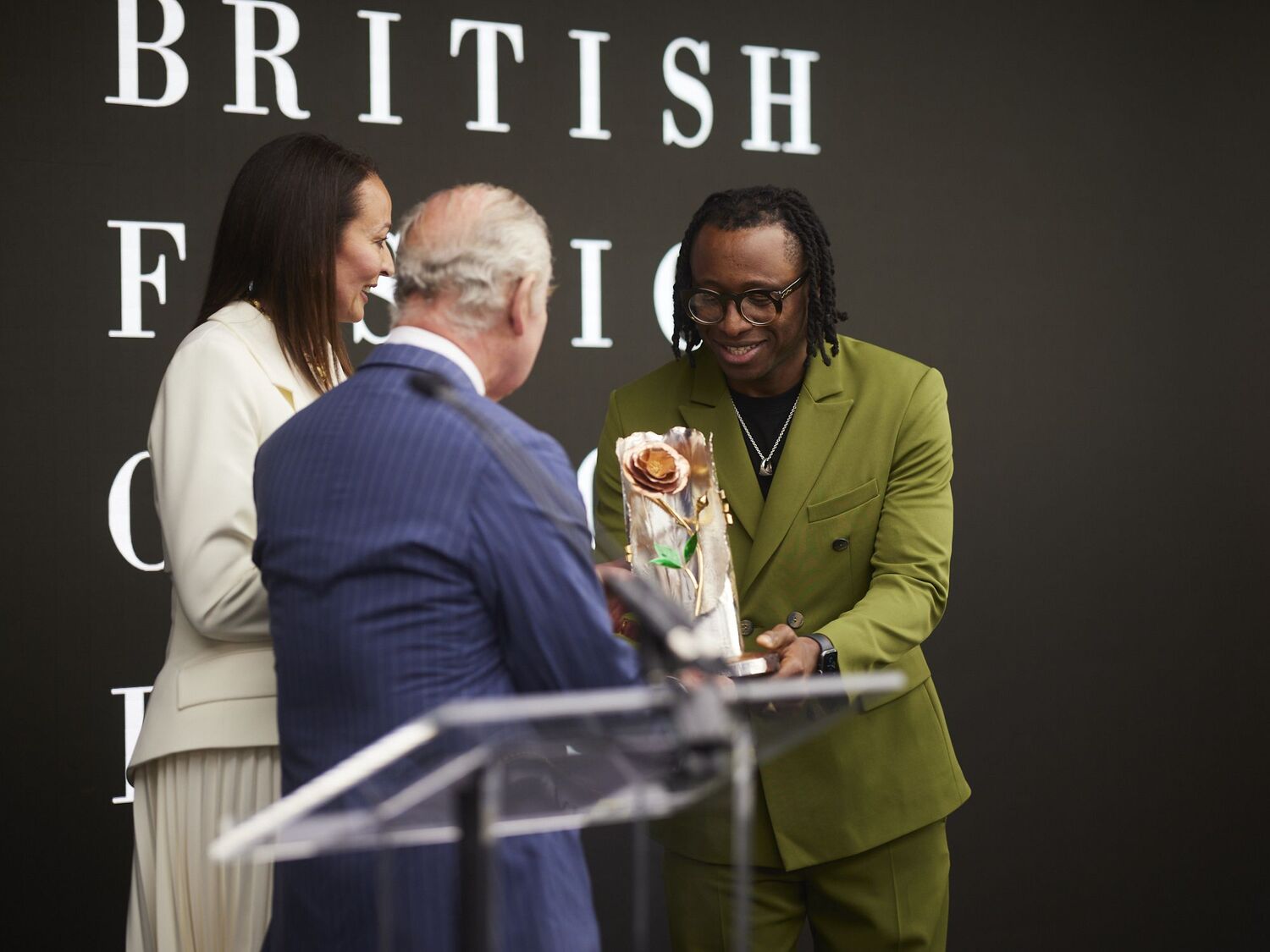 Foday Dumuya accepting his Queen Elizabeth award II award for British Design for Labrum London from King Charles