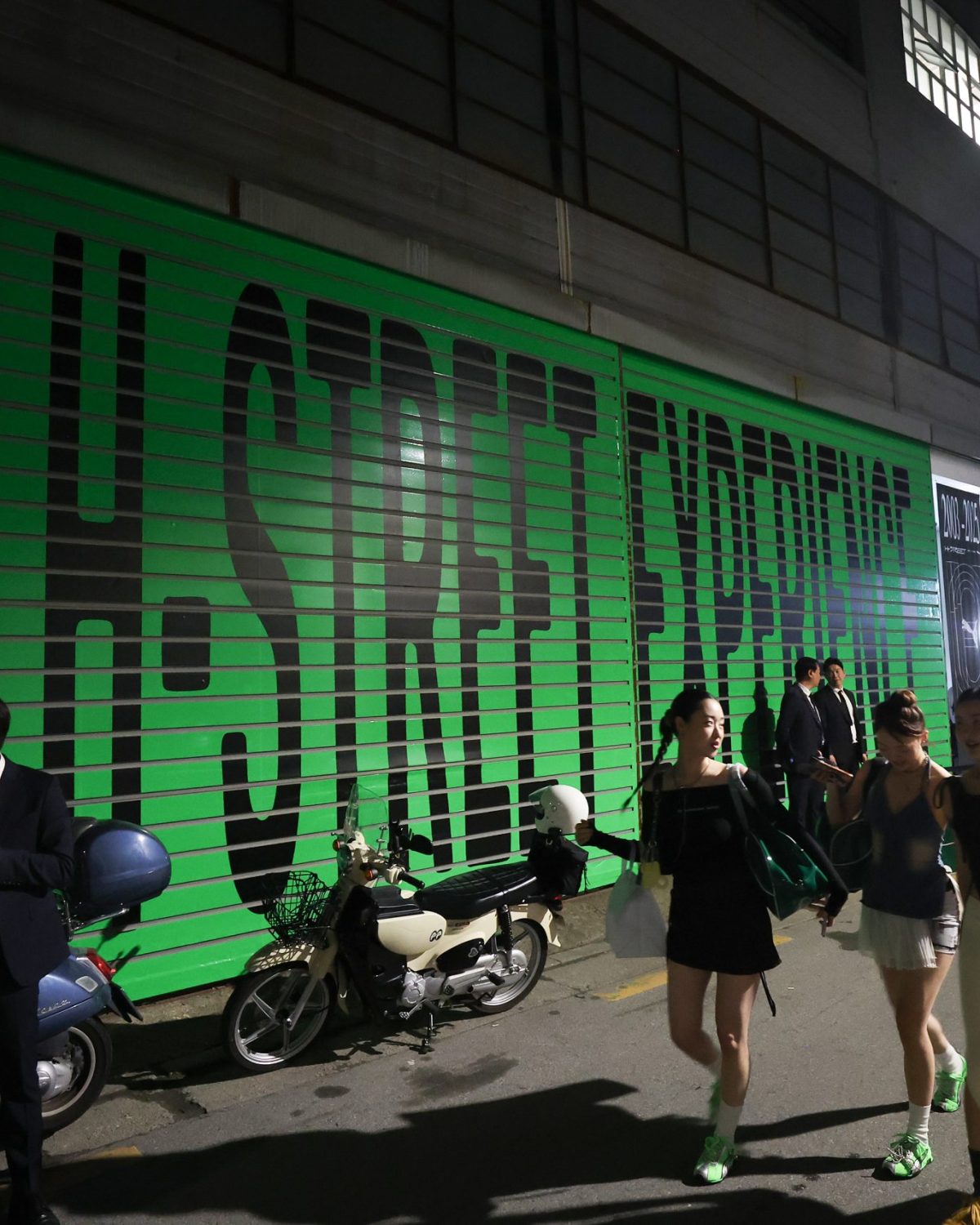 SEOUL, SOUTH KOREA - MAY 15: People walk by the wall decoration of PUMA H-Street Launch Experience at the Studio Layer 41 on May 15, 2025 in Seoul, South Korea. (Photo by Chung Sung-Jun/Getty Images for PUMA)