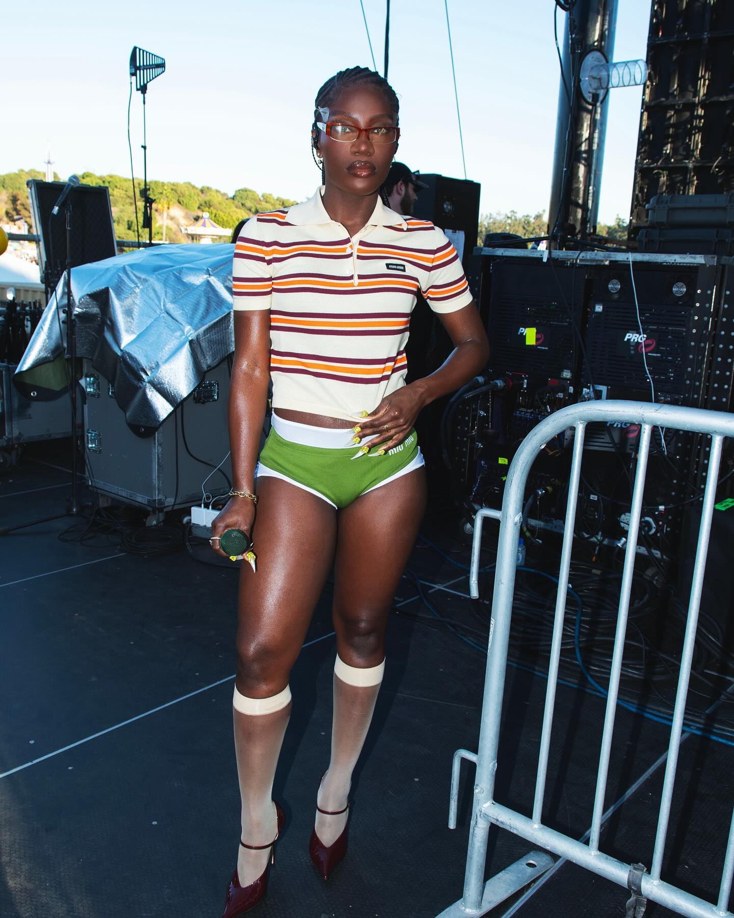 Doechi wears Miu Miu pants set to perform at Camp Flog Gnaw