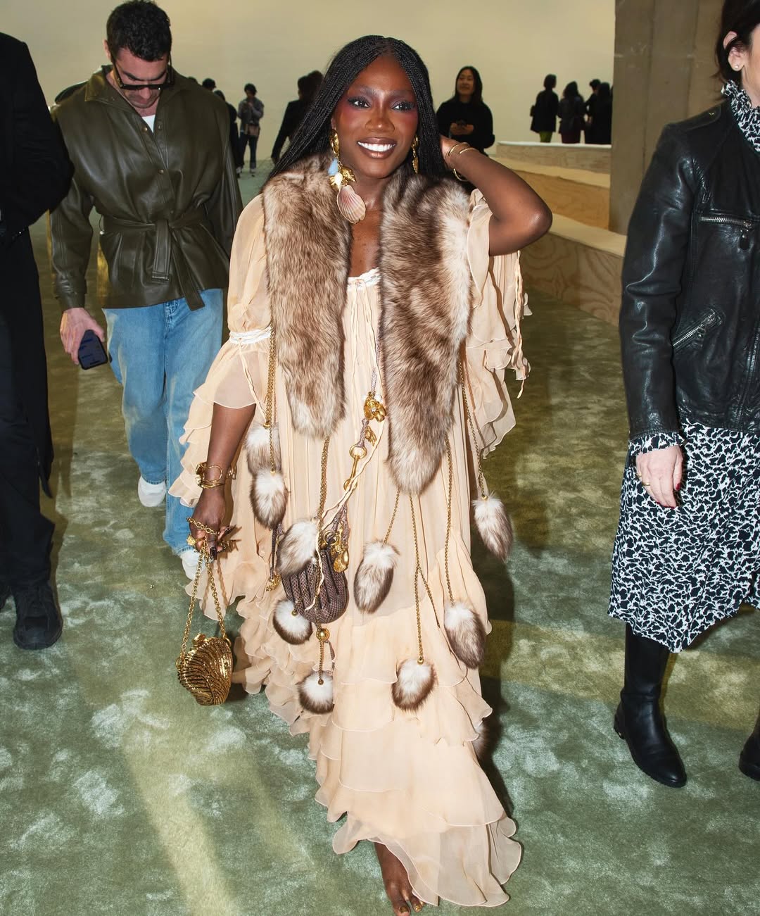 Doechii arrives barefoot in a Chloe gown, to the Chloe FW25 show in Paris.
