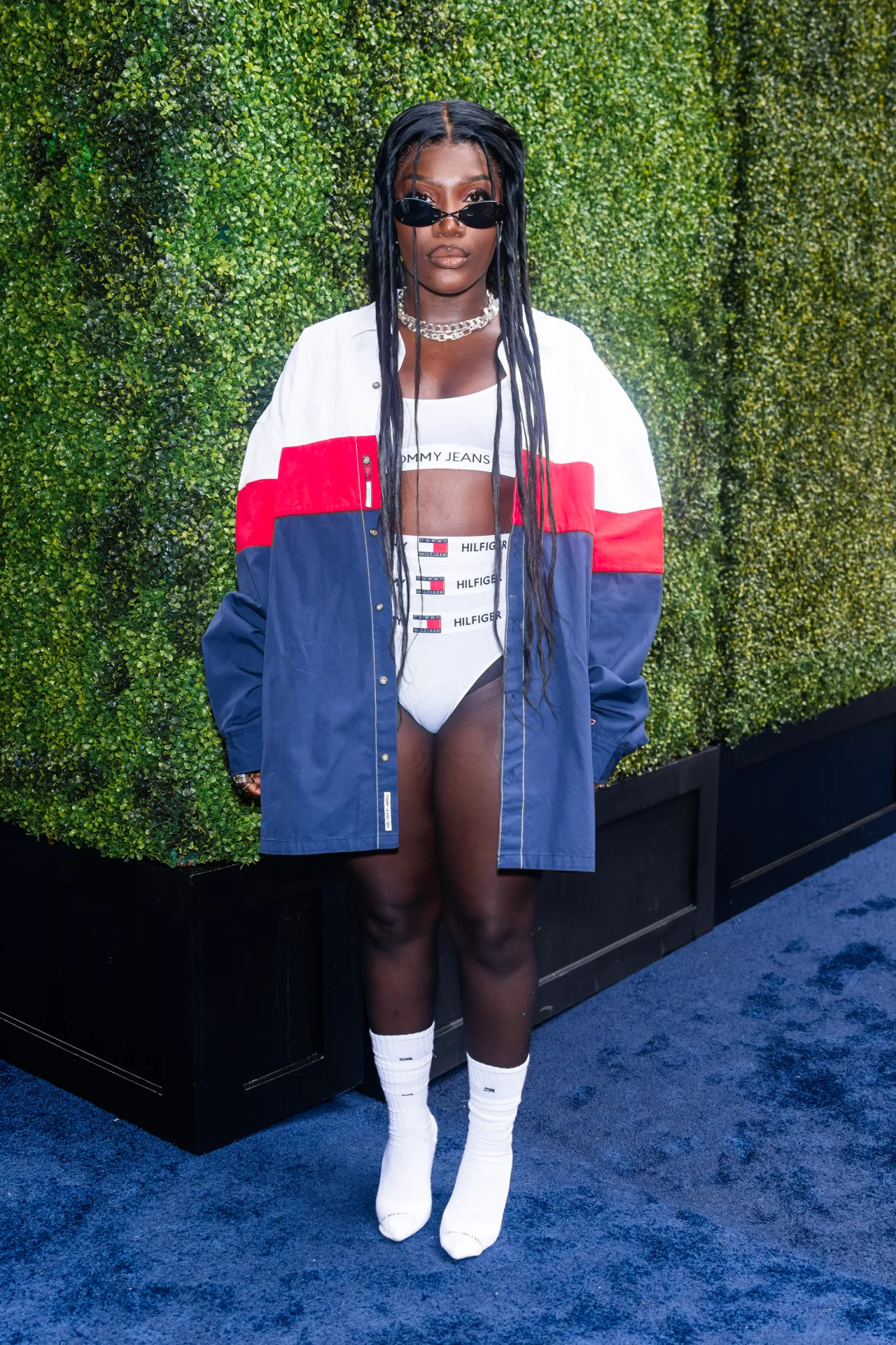 Doechii in layered Tommy Hilfiger briefs and jacket at the 2023 Tommy Hilfiger Fashion Week Brunch