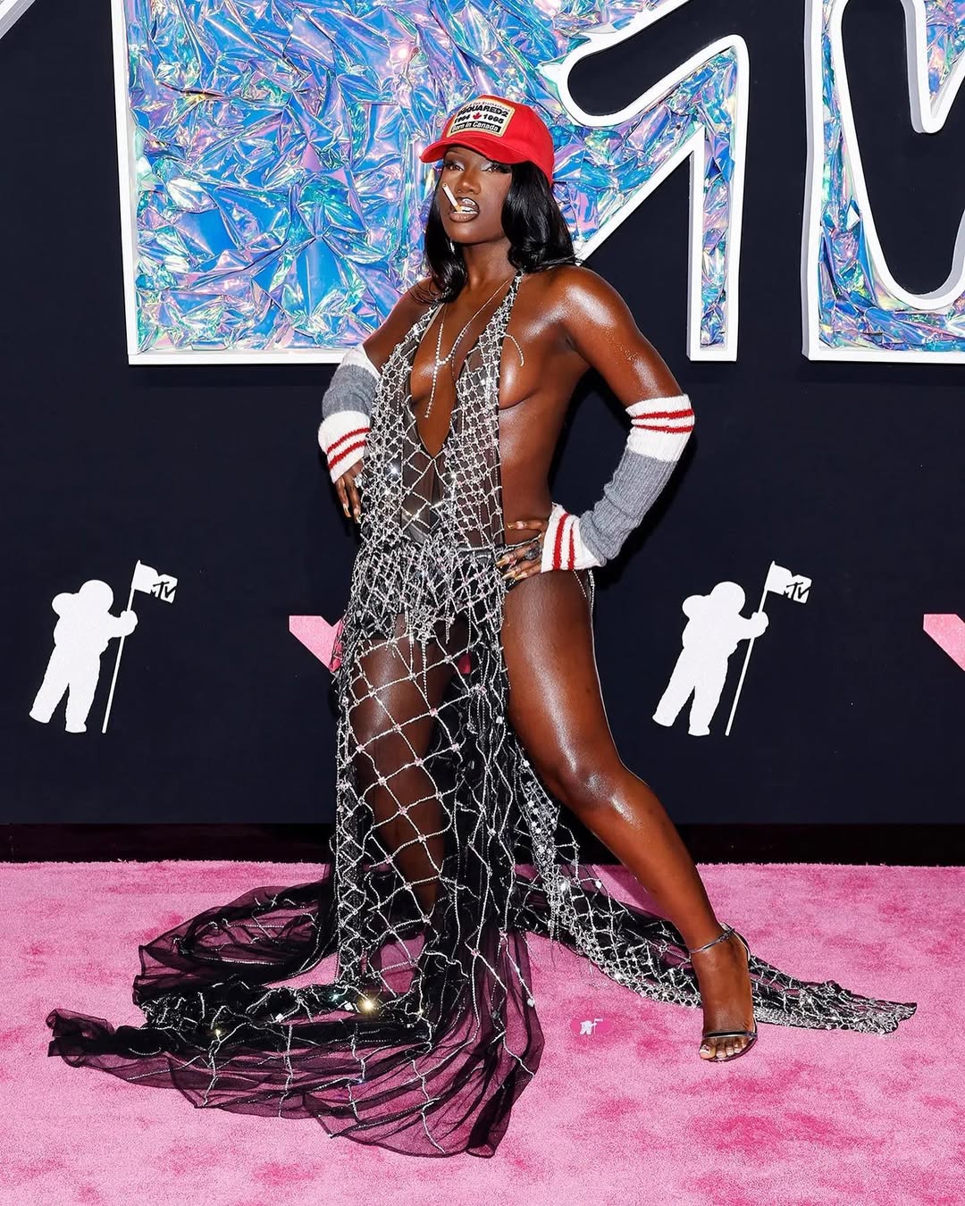 Doechi at the 2023 VMAS in a see through DSQUARED2 dress and DSQUARED2 trucker hat