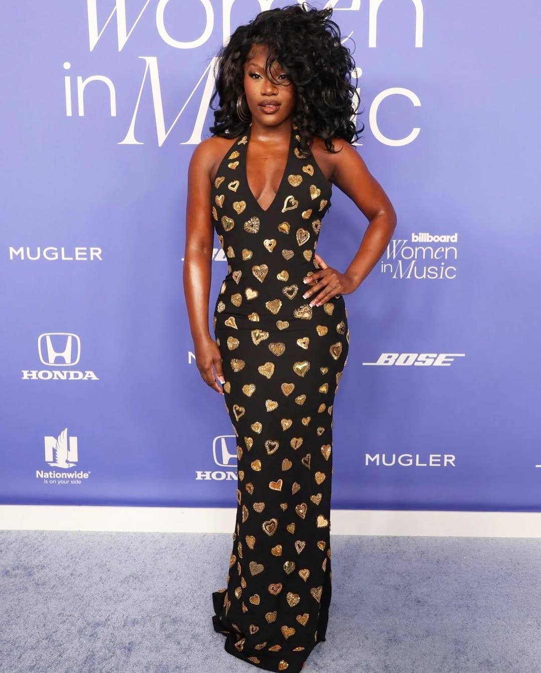 Doechii in a Moschino gown on the 2023 Billboard Women in Music Awards red carpet.