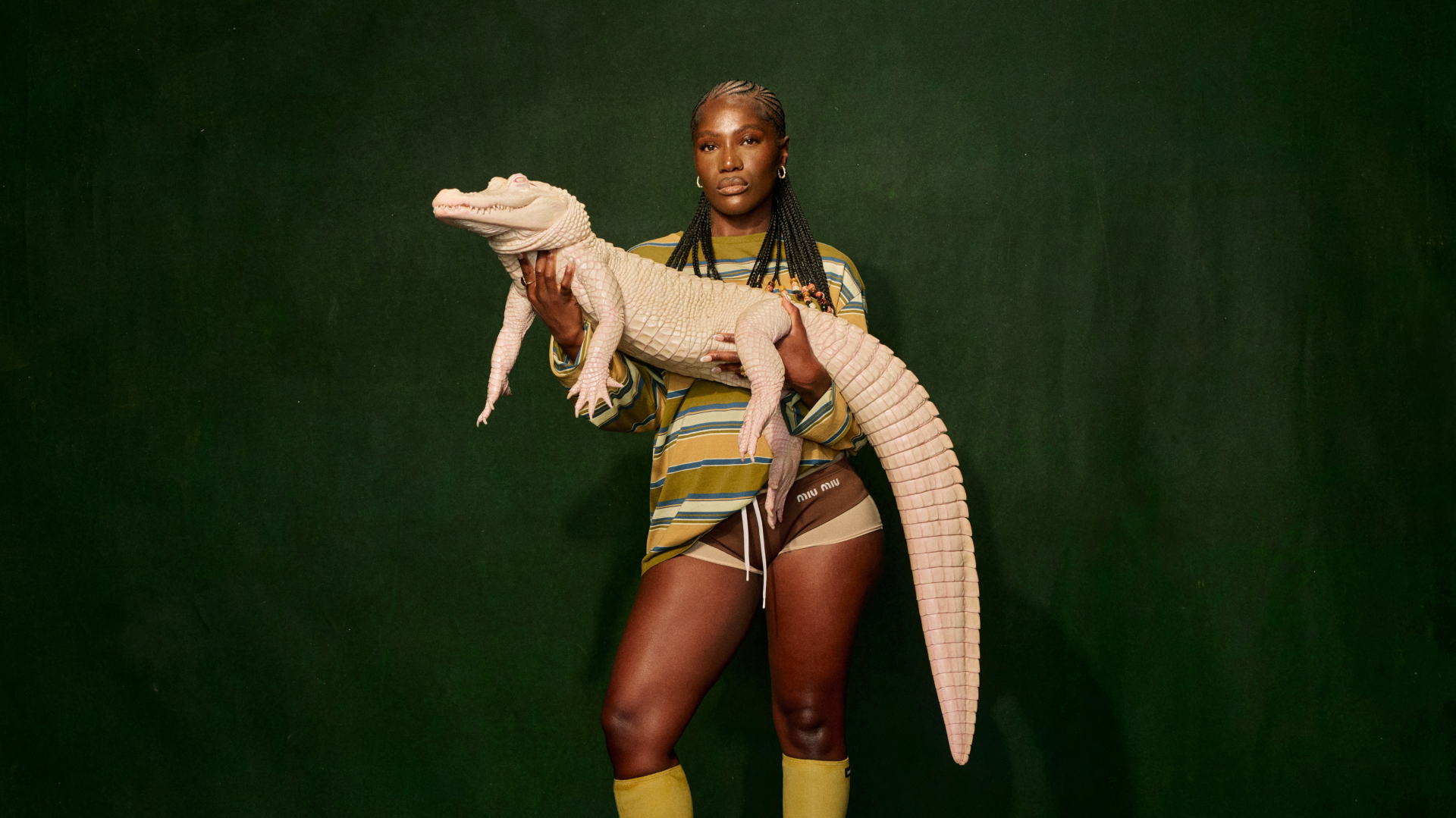 Doechii holds white alligator for the cover of her album 'Alligator Bites Never Heal.'